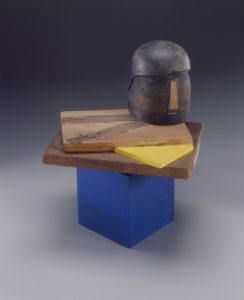 Bearden's "Mauritius", a sculpture comprised of a blue box with wooden panels and a sculpted wooden head on top